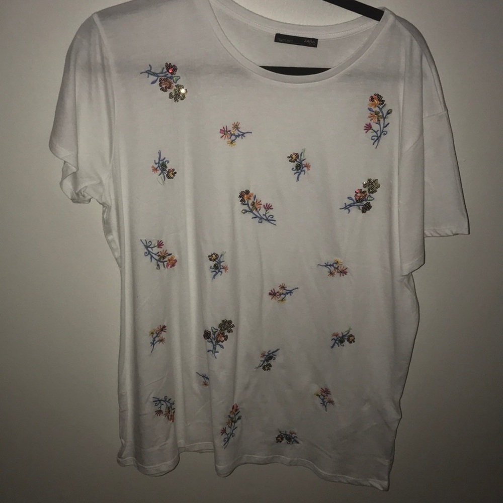 White top with flowers all over